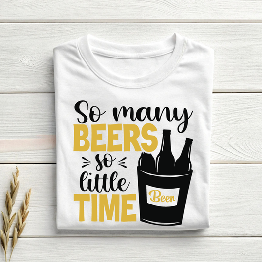 White t-shirt with 'So many beers so little time' text and beer bottle graphic on a wooden surface.