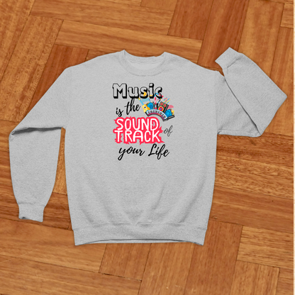 Gray sweatshirt with colorful text design on a wooden floor