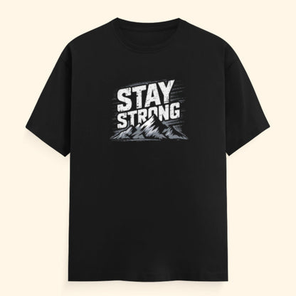 Black t-shirt with 'Stay Strong' text on a beige background