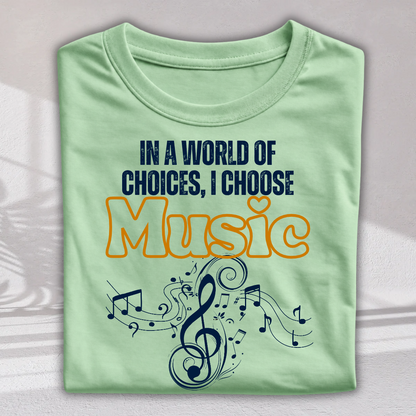 A folded light green t-shirt with a graphic print that reads 'IN A WORLD OF CHOICES, I CHOOSE Music' in navy blue and orange, decorated with a musical treble clef and notes.