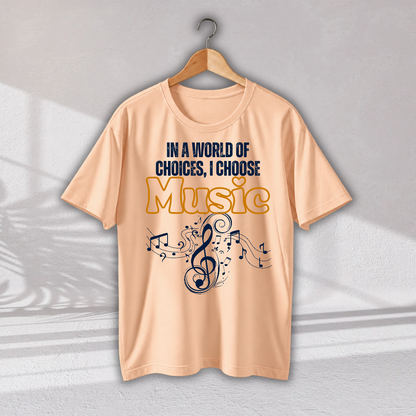 A peach-colored short-sleeve t-shirt hanging on a wooden hanger against a light gray wall. The shirt features a graphic print with the text 'IN A WORLD OF CHOICES, I CHOOSE Music' in navy blue and yellow, accompanied by a musical treble clef and notes.