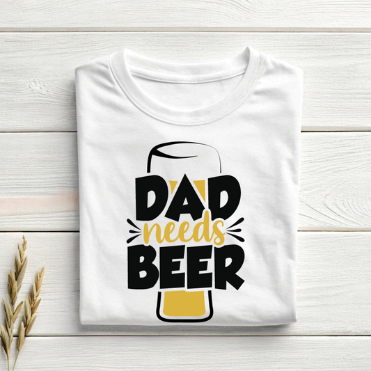 White t-shirt with 'Dad needs Beer' text on a wooden surface