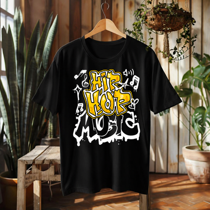 A black short-sleeve graphic t-shirt hanging on a wooden hanger in a rustic indoor setting with plants and wood paneling. The shirt features a bold graphic print reading 'Hip Hop Music' in yellow and white graffiti-style lettering with musical notes.
