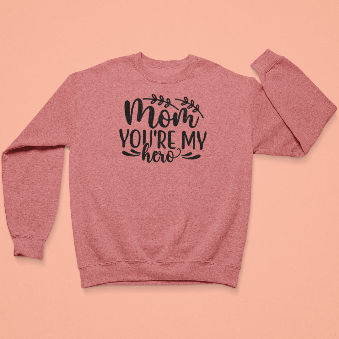 Coral sweatshirt with 'Mom, you're my hero' text on a pink background