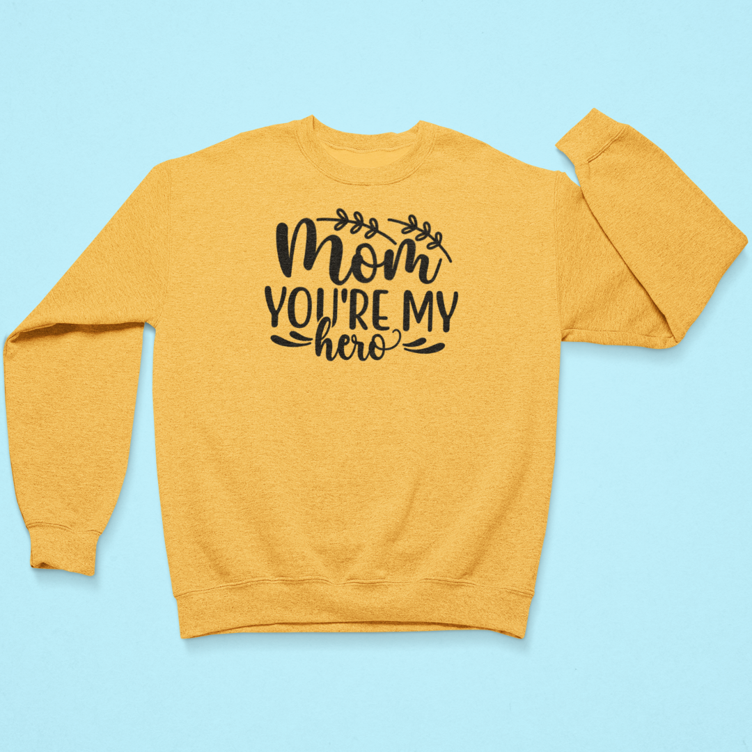 Yellow sweatshirt with 'Mom, you're my hero' text on a blue background