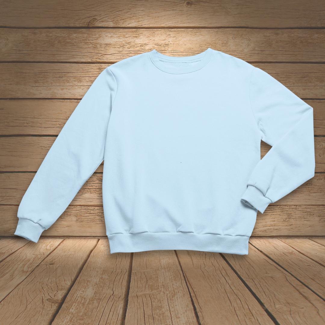 Light blue sweatshirt on a wooden surface