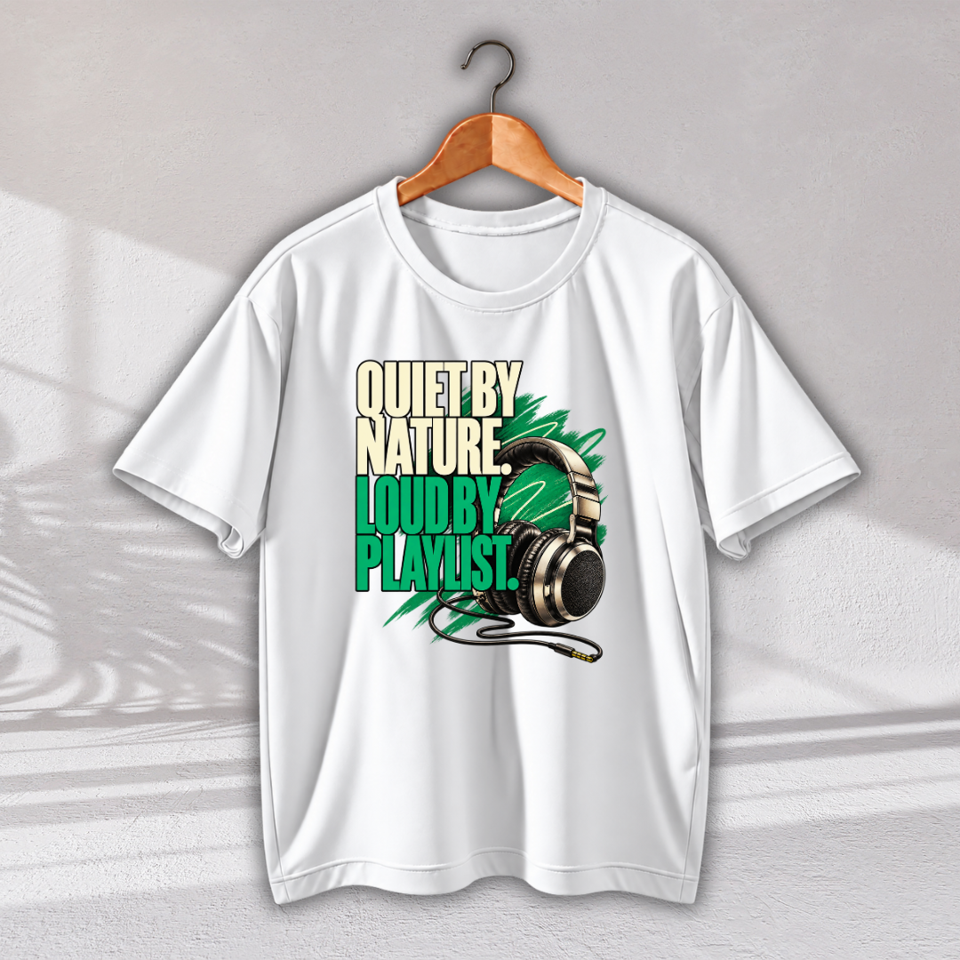 A white short-sleeve graphic T-shirt hanging on a wooden hanger against a light gray wall. The shirt features a bold graphic print with the text 'QUIET BY NATURE.