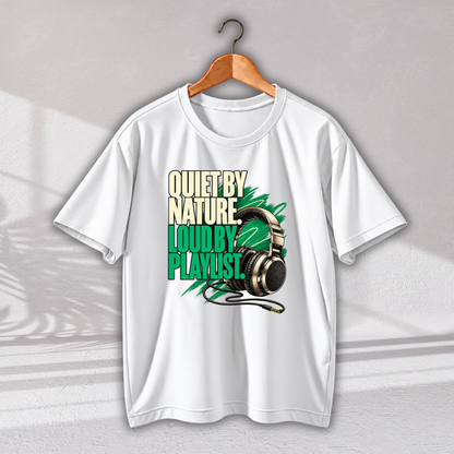 A white short-sleeve graphic T-shirt hanging on a wooden hanger against a light gray wall. The shirt features a bold graphic print with the text 'QUIET BY NATURE.